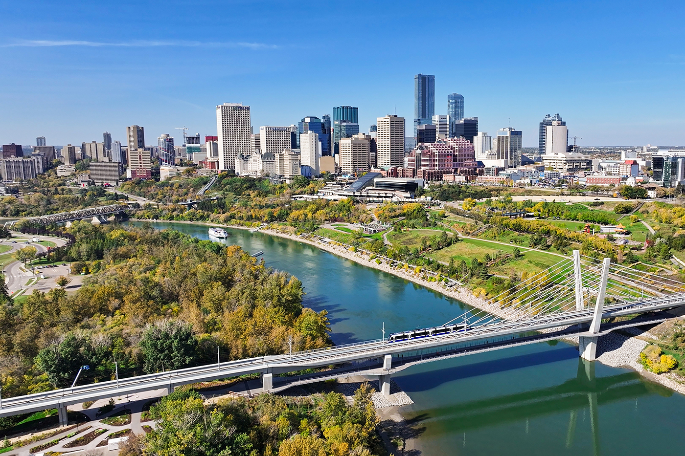 Valley Line LRT is seen crossing the North Saskatchewan River in Edmonton. The city's downtown is seen in the distance